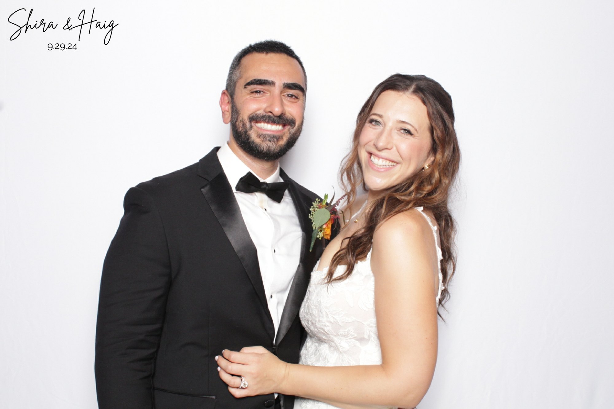 A couple photographed at the booth on their wedding day