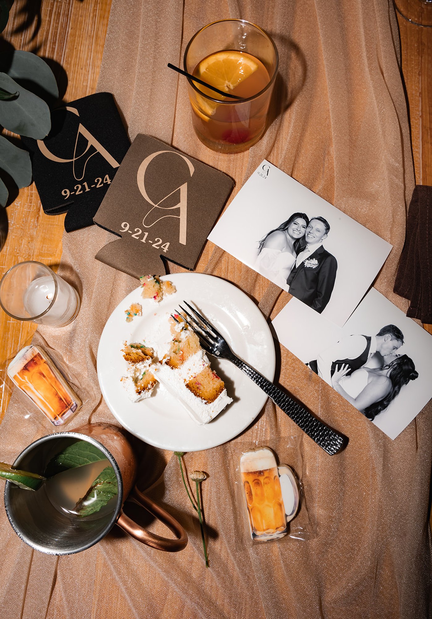 A flat lay of printed photos from the booth on a reception table