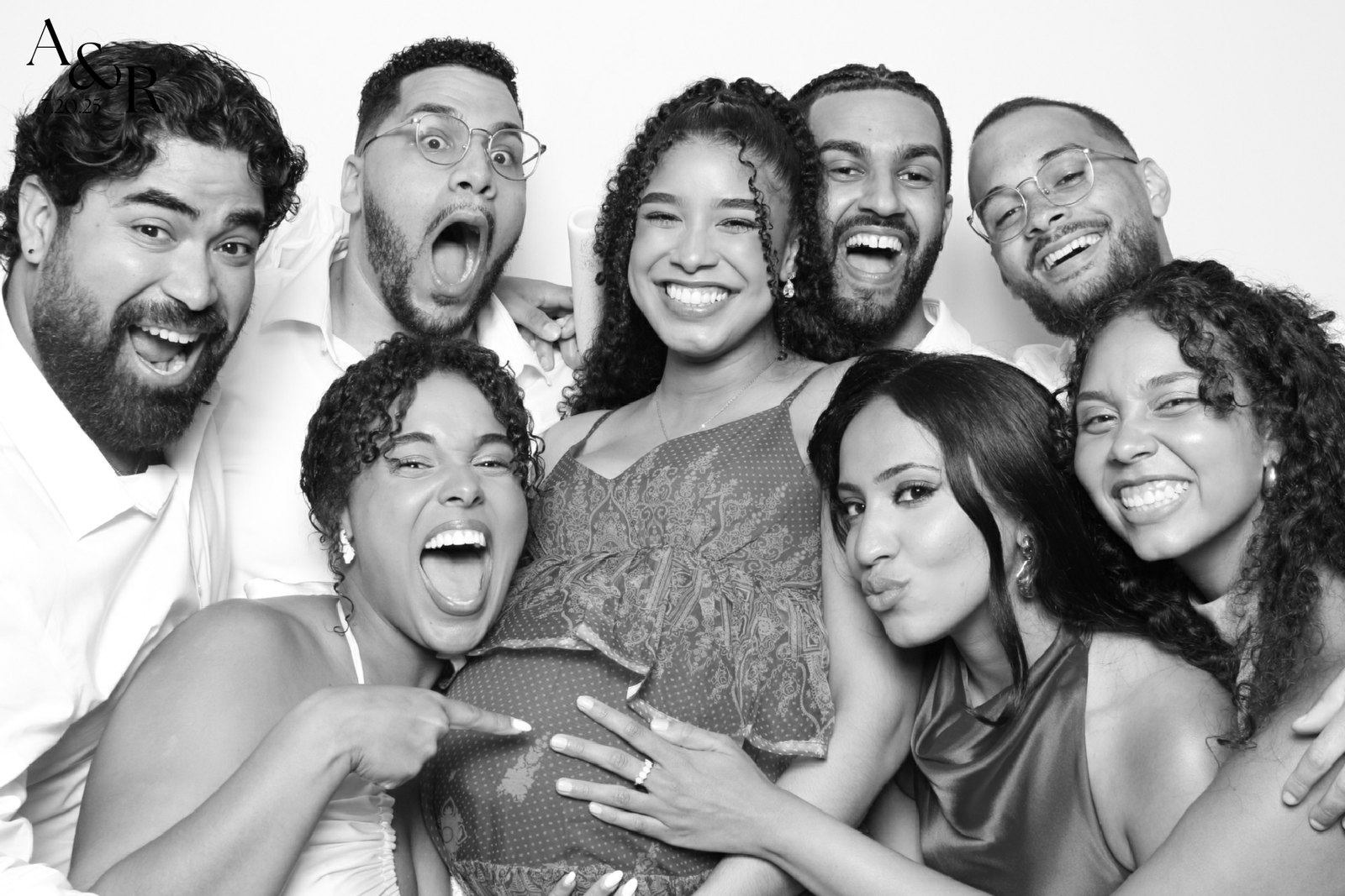 A group of guests laughing together in the booth