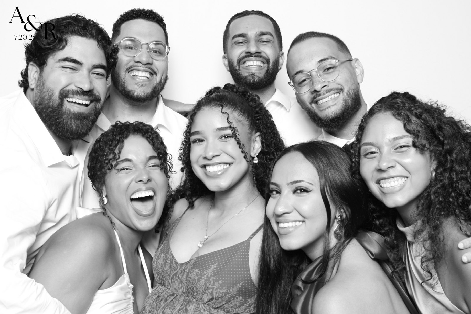 A group of guests crowded into one frame at the booth